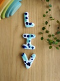 Keramische letters LIV