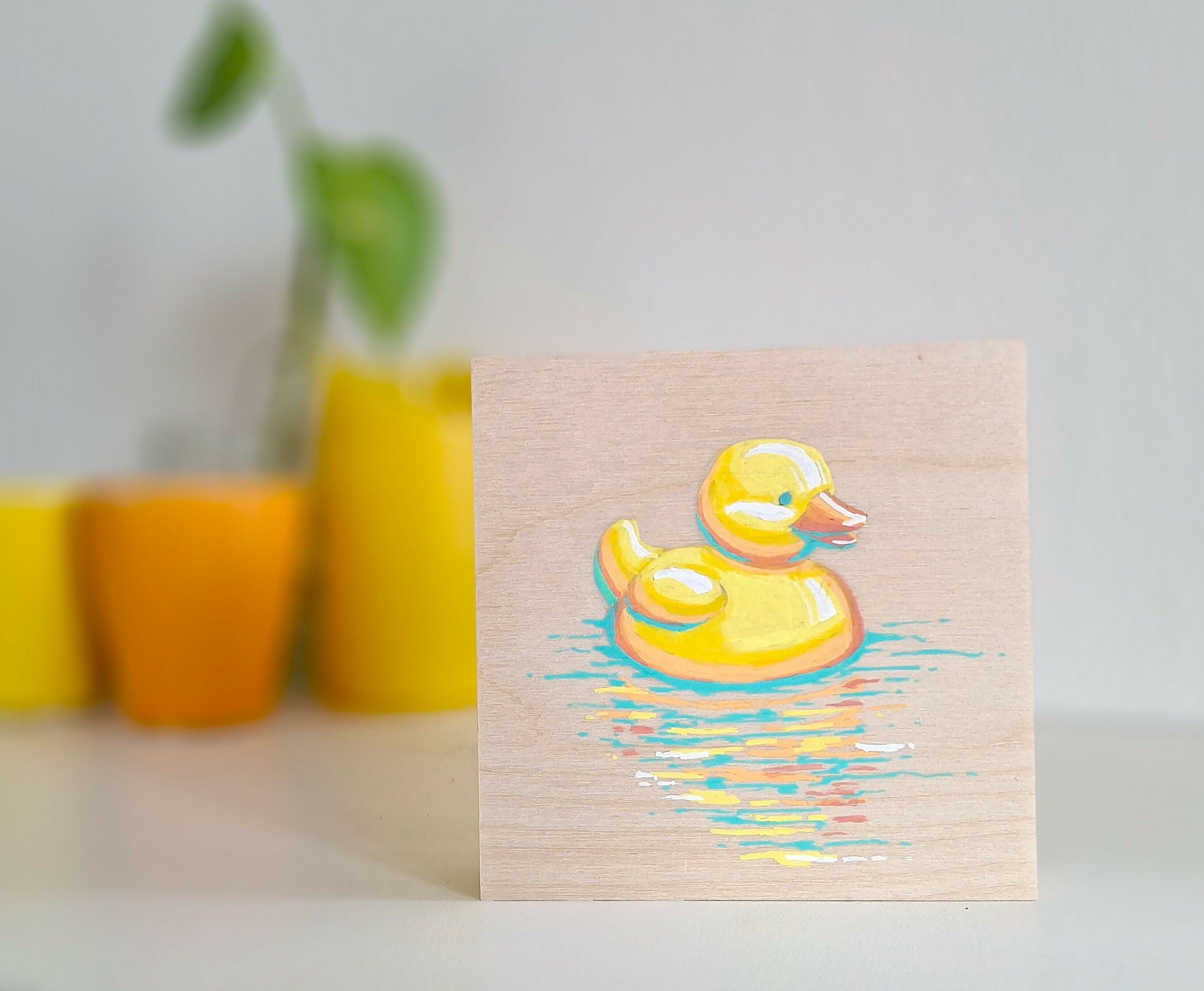 Schattige eendenkunst op hout