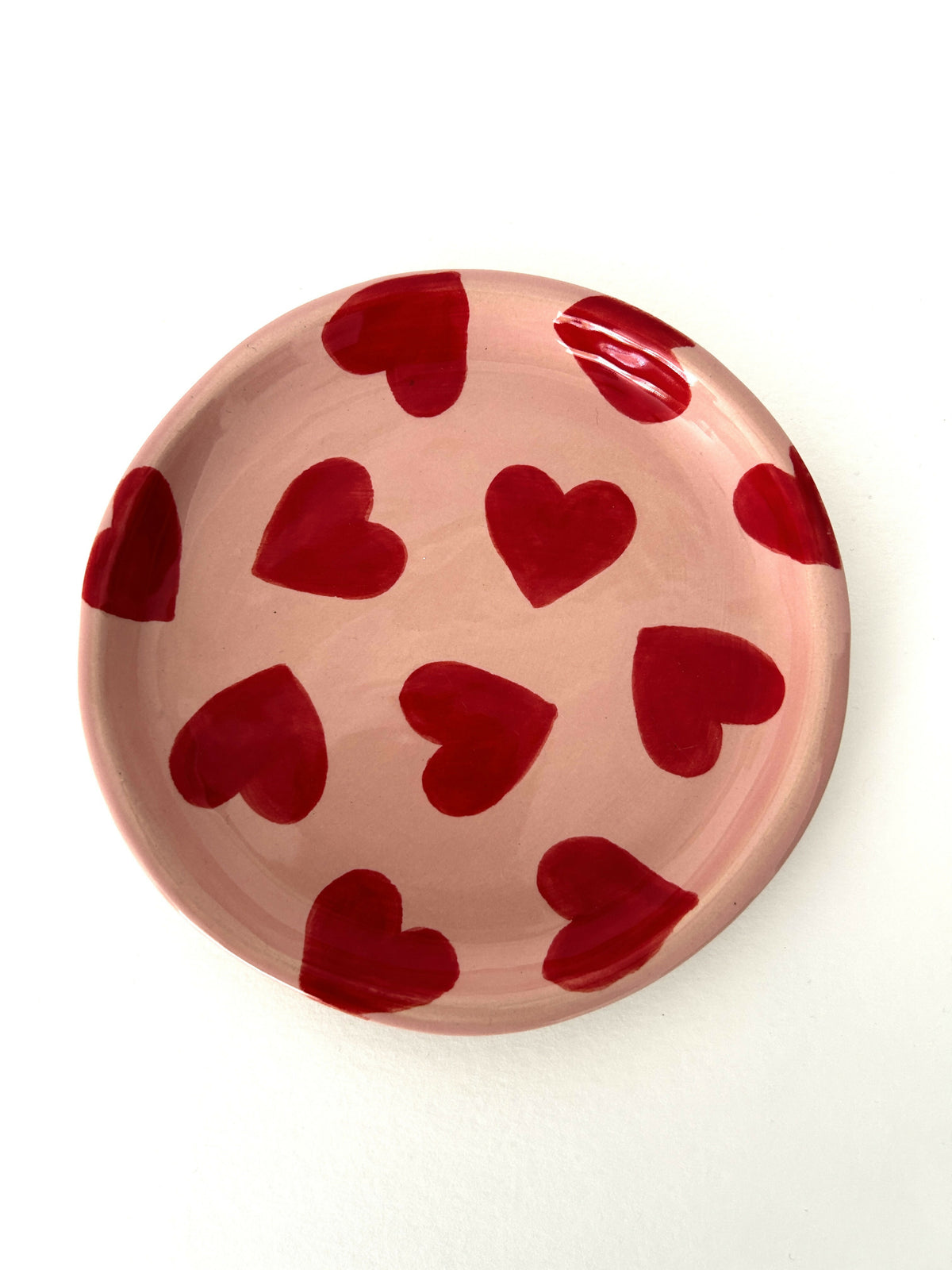 Handmade ceramic plate with smileys in red hearts