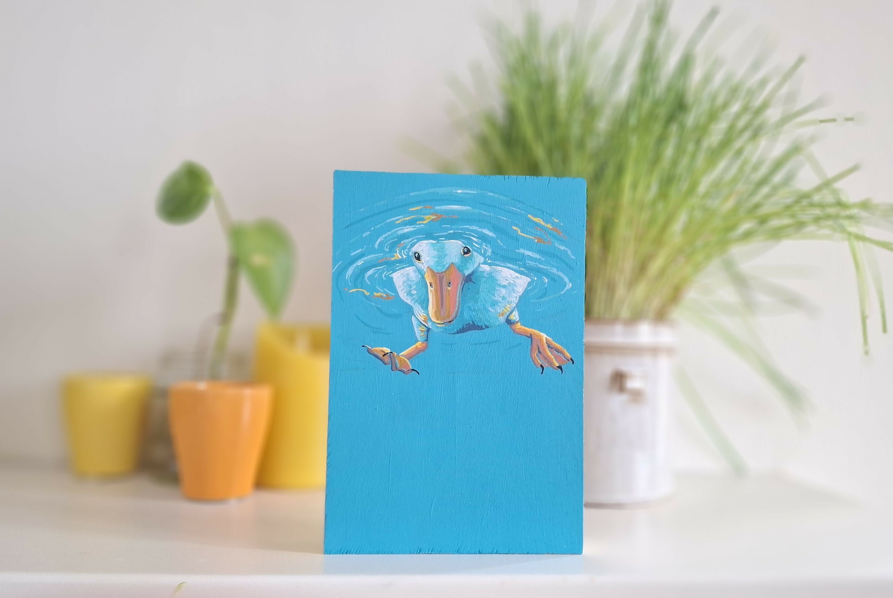 Schilderij van een eend op hout