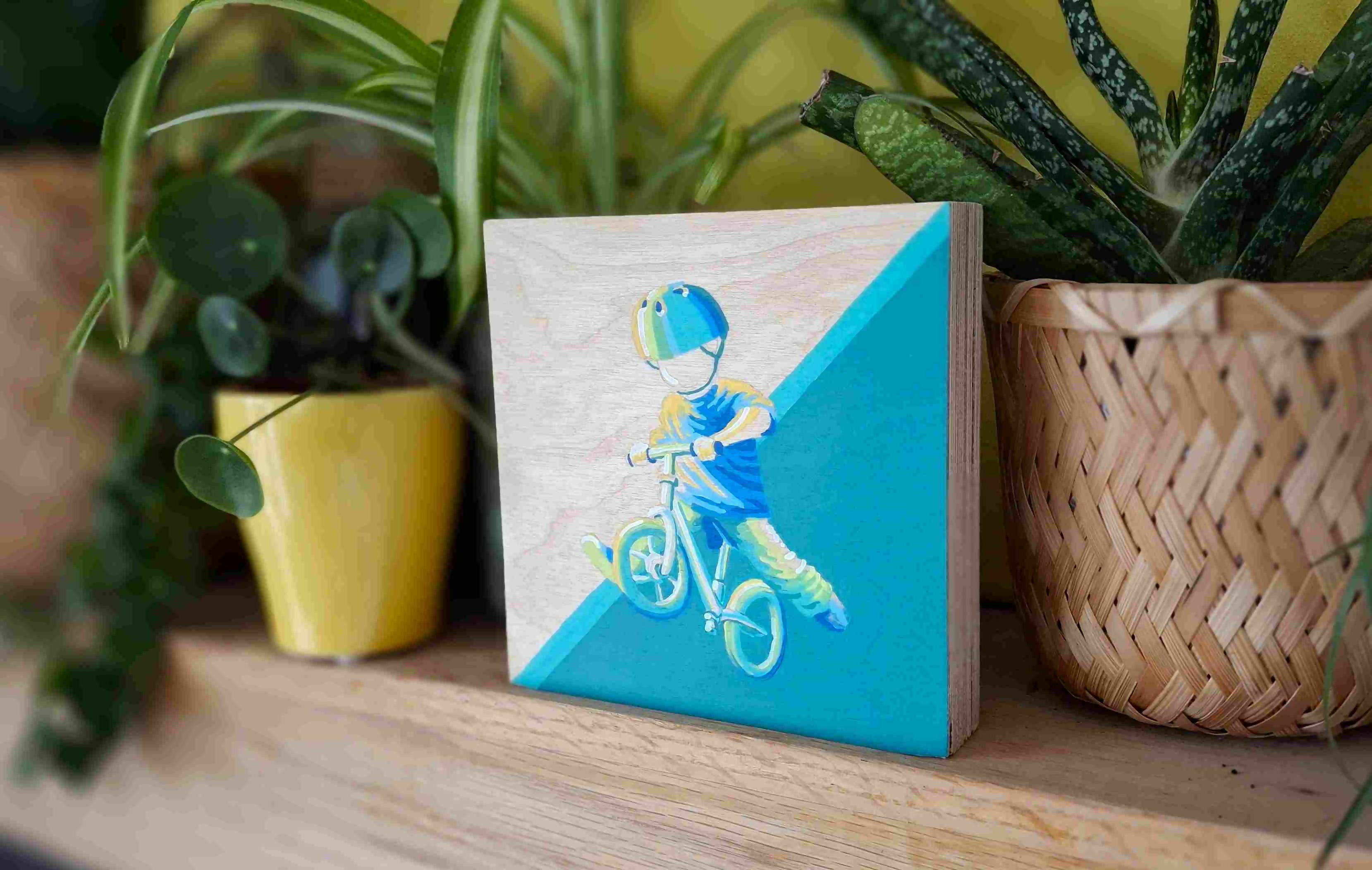 Schilderij van kind spelend op fiets